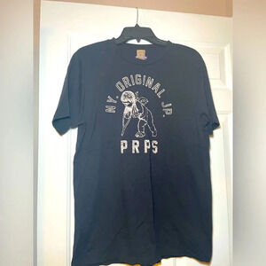 PRPS oRiginal Mens Black Cherub On Crutch Tee LARGE ‘Bruised Never Broken’ NY JP